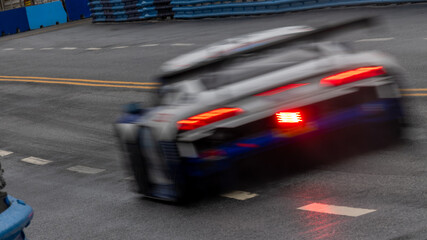 Motion blur race car racing on speed track, Motion blurred super car race on street track circuit, Automobile automotive transportation vehicle background,