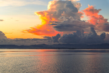 Dramatic Sunset Sky Over Calm Water