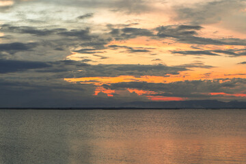 Scenic Lake Sunset with Cloudy Sky