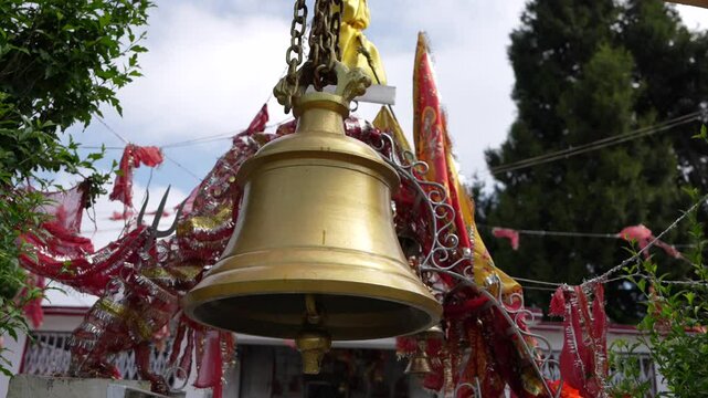 Golden bell tower, Traditional Indian Temple Bell with Sacred Flags - 4K Cultural
