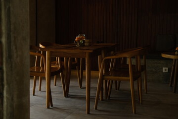 Wooden Tables and Chairs in a Small Café