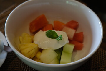 Tropical Fruit Salad with Yogurt in a Bowl