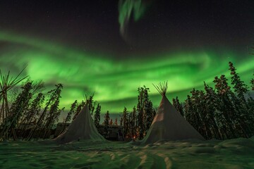 Northern Lights, Aurora Borealis over Teepee and Forest, Yellowknife, Northwest Territories, Canada