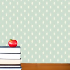 Red apple on pile of books