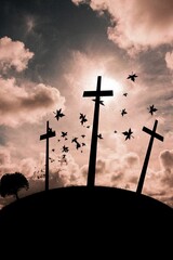 Cross religion symbol shape over sunset sky