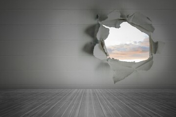 Rip on wall showing bright sky