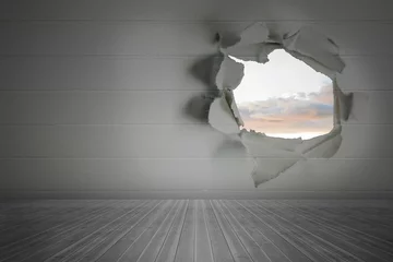 Poster Rip on wall showing bright sky