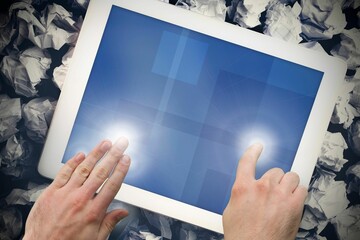 Hands touching tablet screen
