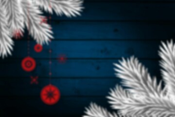 Blurred fir tree branches on wood