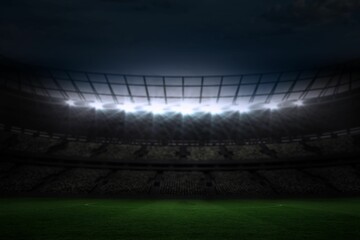 Large football stadium under night sky