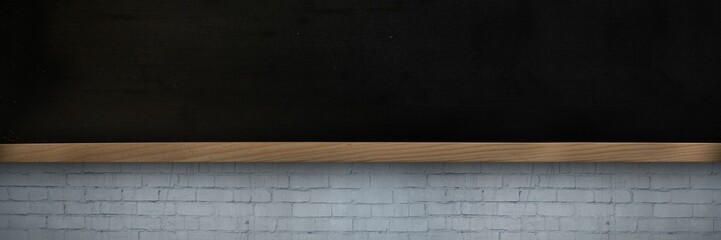 Flat design is showing large black chalkboard mounted on painted gray brick wall with wooden ledge