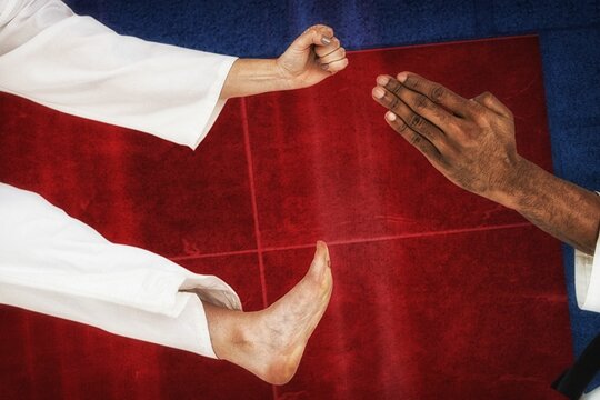 Cropped hands of fighters