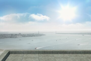 Flat design is showing tiled stone terrace with parapet overlooking sea with boats and bridge