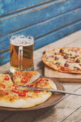 Gordijnen Pizza with beer glass in plate © vectorfusionart