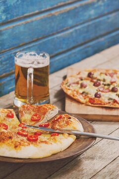 Naklejki Pizza with beer glass in plate