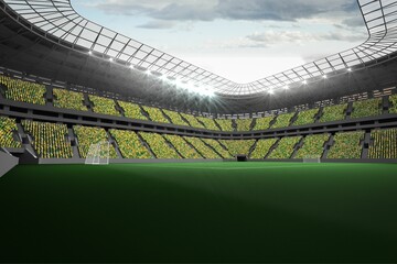 Large football stadium with fans in yellow