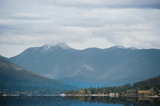 Fototapeta Scenic view of mountains against cloudy sky