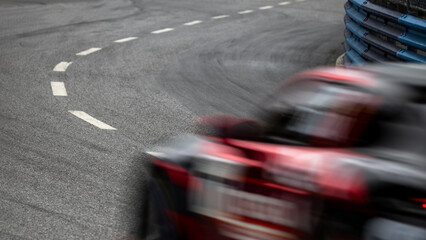 Motion blur race car racing on speed track, Motion blurred super car race on street track circuit,...