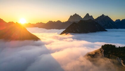 Sunrise over alpine peaks, clouds swirling