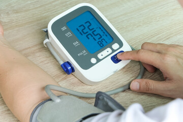 Man check blood pressure monitor and heart rate monitor with digital pressure gauge. Health care...