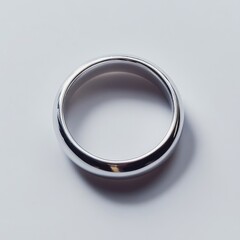 Fototapeta premium Simple silver band ring on white background.