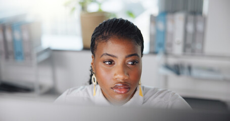 Office, black woman and thinking with computer for reading, online information or fact check story....