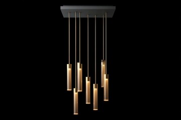 Minimalistic chandelier of satin-gold slender rods and opal glass cylinders hanging above a black glass desk dusk ambient