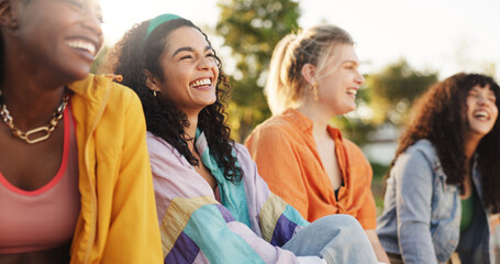 Friends, relax and women with laughing at park for funny conversation, gossip story and bonding. Gen z fashion, people and happy outdoor for weekend together, social gathering and comic discussion