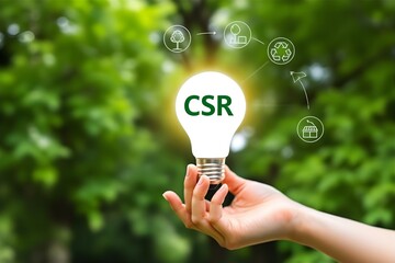 CSR Concept: Hand Holding Light Bulb with CSR Text & Green Icons - Corporate Social Responsibility Image