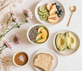 Flat lay of a healthy breakfast set on a light background with flowers. 