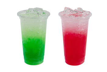 Green and red iced soda drinks in plastic cups
