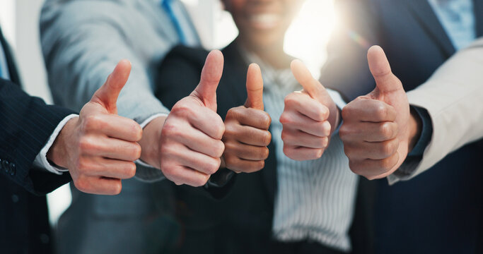 Thumbs up, team and hands of business people for support, success and approval in office. Professional, corporate and workers with emoji, gesture and yes sign for agreement, achievement and feedback - Powered by Adobe