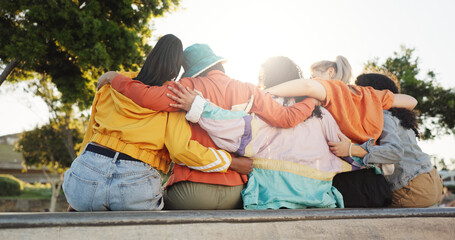 Women, friends or fashion with hug in park for urban style, community or bonding together. Back...