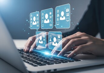 Hands typing on a laptop with glowing digital interface showing user profiles and icons