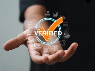 Orange checkmark verified symbol with surrounding icons displayed over an open hand verification approval