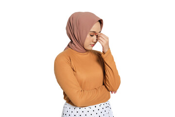 Muslim woman in hijab closing eyes and touching head with hand as if having headache isolated on...