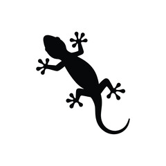 Obraz premium A black gecko silhouette is climbing, representing wildlife and tropical environments