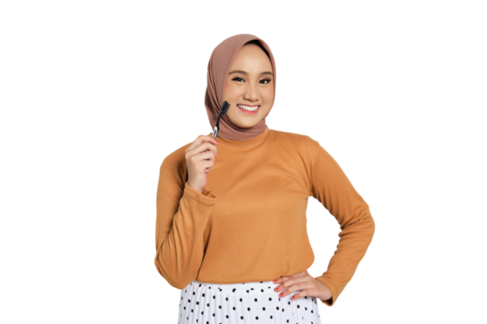 Smiling Muslim woman in hijab holding toothbrush with dental care concept isolated on transparent background