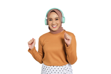 Happy Muslim woman in hijab dancing and enjoying music with headphones isolated on transparent background