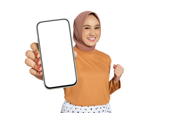 Excited woman wearing hijab holding blank smartphone screen and making fist gesture isolated on transparent background