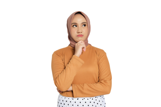 Thoughtful young Muslim woman in hijab with hand on chin looking up isolated on transparent background