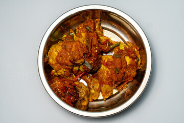 Village chicken cooked with spicy red sambal and pete, offering a unique savory and spicy flavor. This dish is perfect for those who enjoy spicy food with a strong pete aroma.