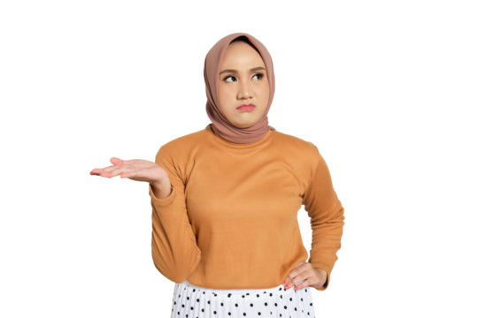 Unimpressed young Muslim woman in hijab raising hand with annoyed expression isolated on transparent background