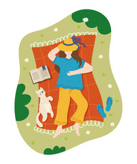 A girl and a cat are lying on a blanket in a meadow