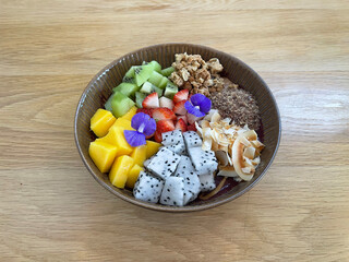 Acai bowl is a Brazilian-inspired dish made from pureed, frozen acai palm fruit, typically served in a bowl as a smoothie and topped with various ingredients. 