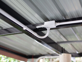 Electrical conduit connection points installed on metal roof sheets