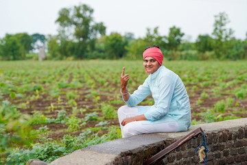 farmer showing finger or voting sign after voting