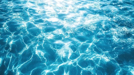 Fototapeta premium A serene blue pool with gentle ripples and sunlight reflecting on the surface.