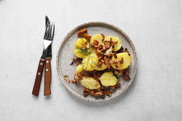 Baked potatoes with chanterelles and onion, top view