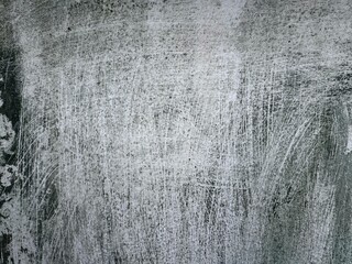 This image features a close-up view of a wall with an abstract design. The primary color is grey,...